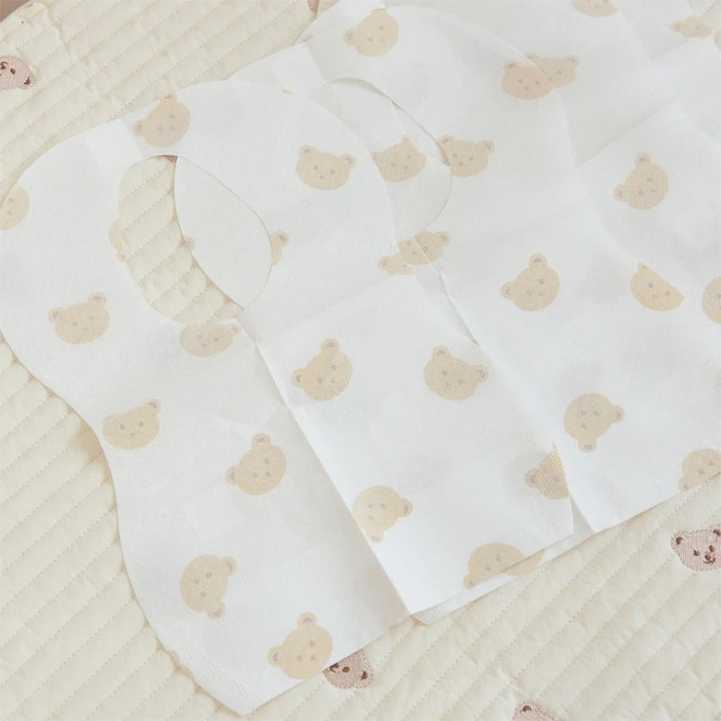 50-Pack Disposable Baby Bibs – Waterproof Cartoon Bear Feeding Bibs for 6M–2Y