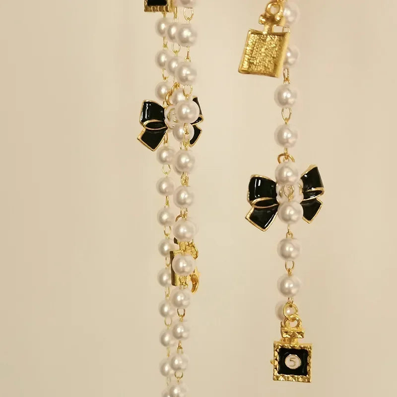 Black & White Bow Pearl Glasses Chain Lanyard – Sunglasses Accessory for Women
